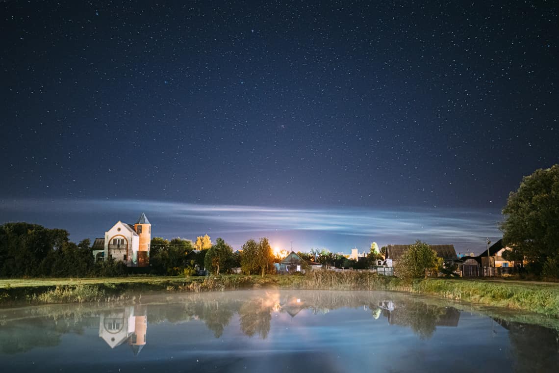 Is The Sabbath 12 Or 24 Hours - night clouds over village lake