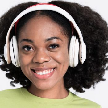live at 5 - young-black-woman-smiling-while-listening