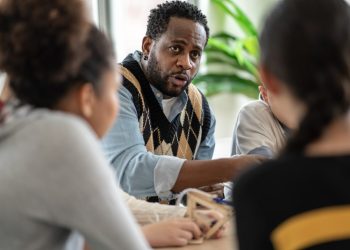 short teaching - african-teacher-explaining-and-teaching