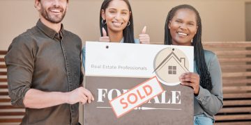 sin-loves-buying-and-selling-shot-of-a-young-couple-their-real-estate-agent