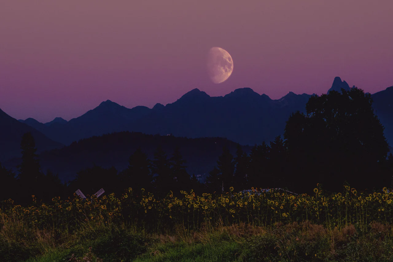 moon-rising-landscape-over-mountain-range